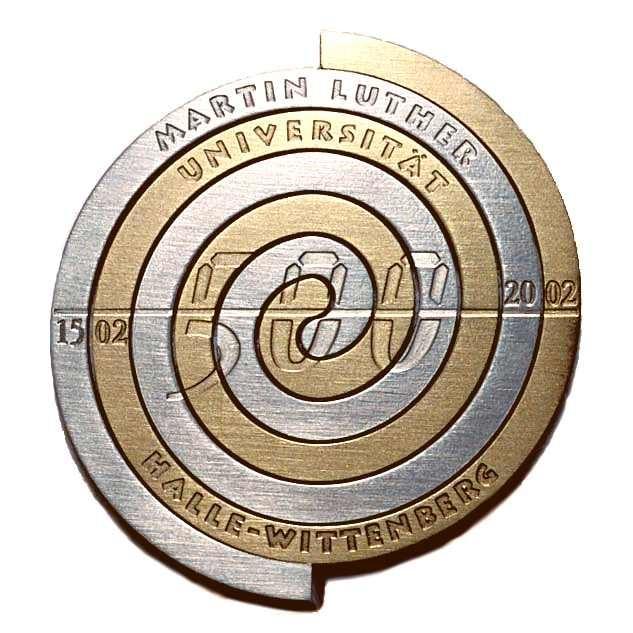 Medaille Medaille aus Silber und Messing Spiralen